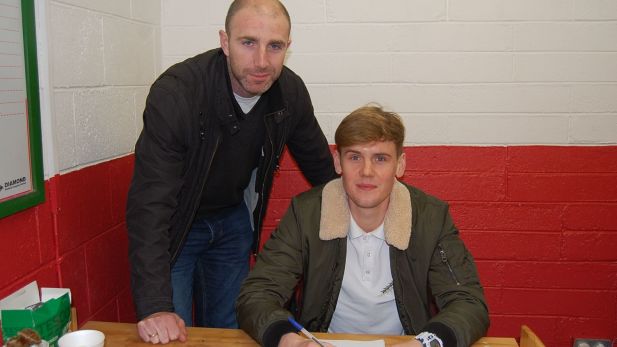 An Image of Owen Heary securing the signing of Adam O Connor.