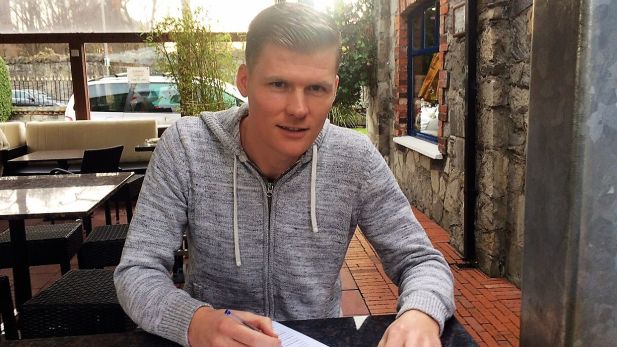 An image of Derek Prendergast signing for Shelbourne FC.