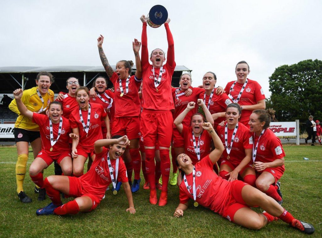 Womens team celebrate with the cup