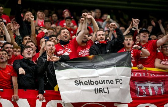 28 August 2025; Shelbourne supporters celebrate after the UEFA Conference League Play-off Round second leg match between Linfield and Shelbourne at the Clearer Twist National Football Stadium at Windsor Park in Belfast. Photo by Ramsey Cardy/Sportsfile